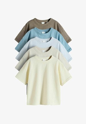 Five plain short-sleeve crewneck t-shirts stacked, colors from front to back: cream, beige, light blue, sky blue, and brown.