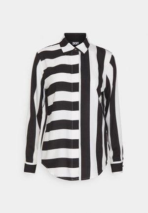 Svart og hvitstripet skjorte med knapper og lange ermer, med krage, kontrasterende stripebredder og buet kant.