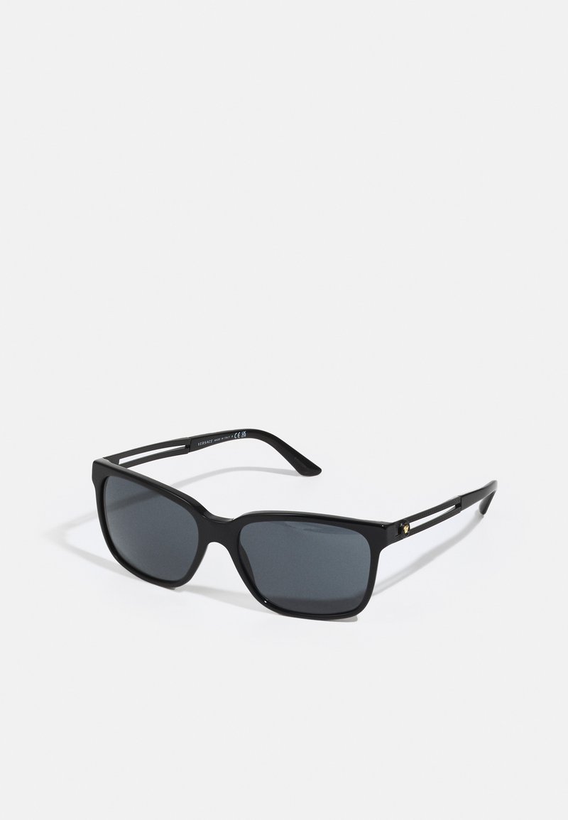 Black sunglasses with rectangular frames, gradient dark lenses, and glossy finish. Feature slim metallic accents on the temples.