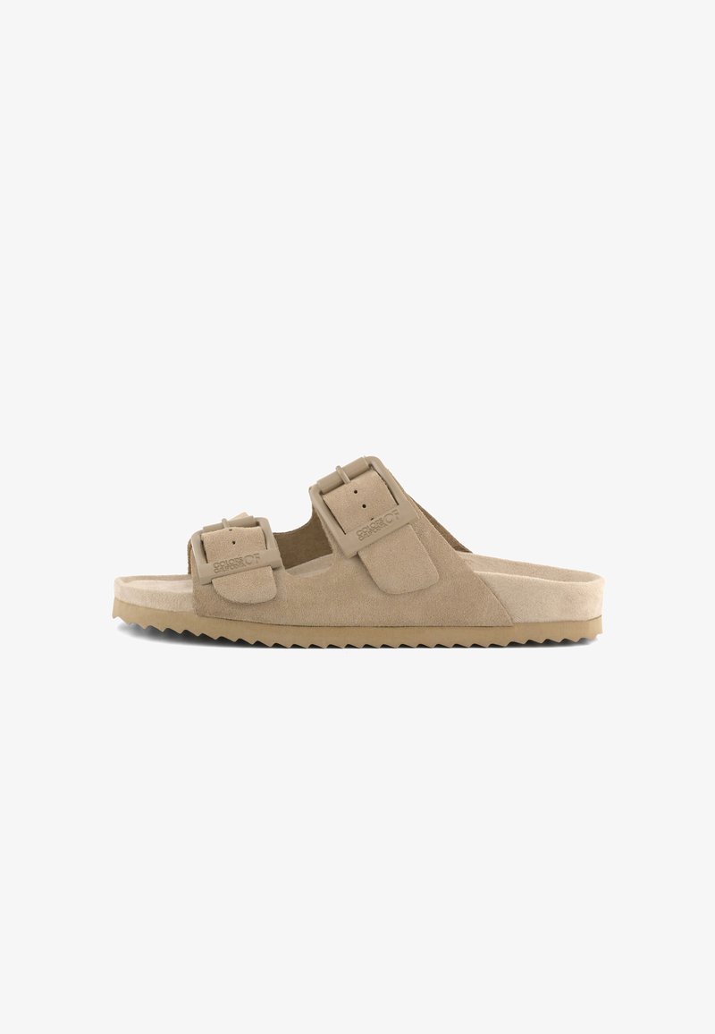 Beige suède open-toe slidesandaal met twee verstelbare gespsluitingen en een gestructureerde zool voor grip.