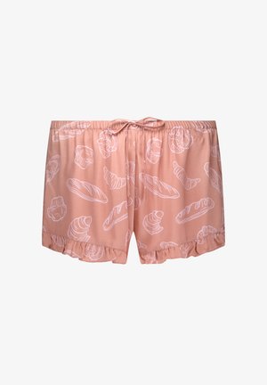 Rosa shorts med snøring i livet, med et hvitt bakgrunnsmønster av bakverk. Designet inkluderer volangkanter for ekstra detalj.