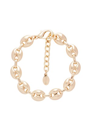 Bracelet doré avec des maillons ovales et allongés alternés, fermoir homard et chaîne ajustable avec petite étiquette de la marque.