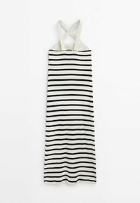 Robe à rayures noires et blanches avec bretelles croisées dans le dos. Fabriquée en tissu léger, avec une coupe droite et une texture lisse.