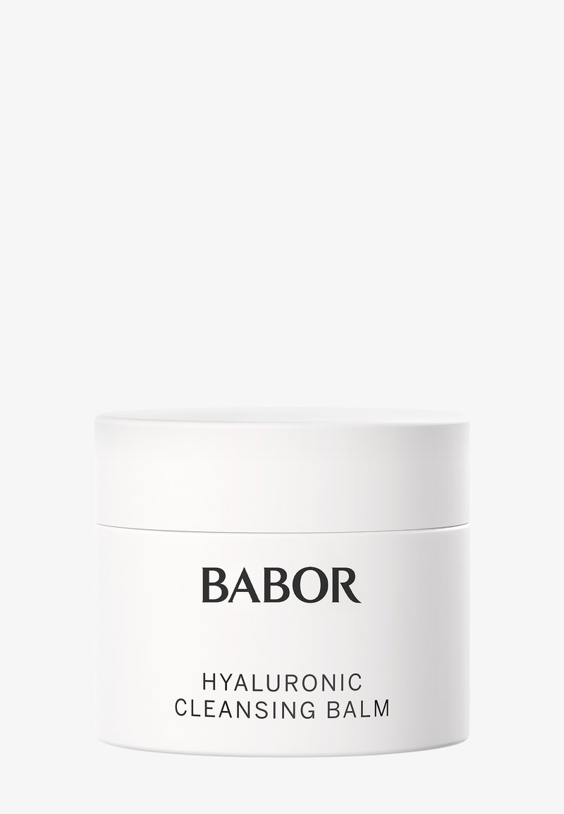 Conteneur circulaire blanc étiqueté "BABOR HYALURONIC CLEANSING BALM." Surface lisse, design minimaliste et texte noir clair.