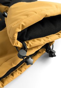 Gul och svart isolerad tygmanschett med dragsko, med texturerat tyg och svarta detaljer för justering.