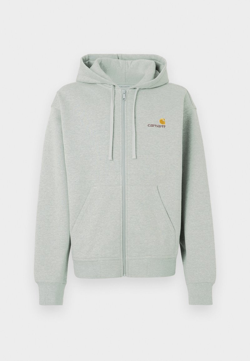Hellgrauer Reißverschluss-Hoodie mit einer Vordertasche, gerippten Bündchen und einem kleinen orangenen Logo auf der linken Brust. Hergestellt aus weichem, strukturiertem Stoff.