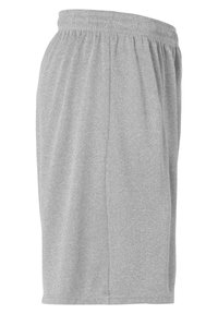 Grijze sportieve shorts van een zachte, gestructureerde stof, met een elastische tailleband en een losse pasvorm, voorzien van zijsneden voor extra structuur.