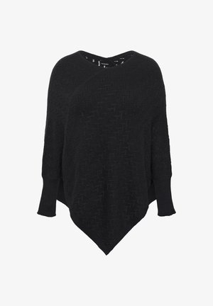 Black knit poncho with a textured pattern, V-neck design, and loose sleeves. Features a triangular hem and soft fabric.