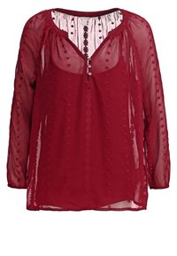 Blouse longue à manches longues en bordeaux transparent avec broderie florale, col rond, patte de boutonnage à trois boutons et tissu léger et fluide.