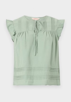 Light green short-sleeve blouse with ruffled sleeves, front tie at the round neckline, and horizontal pintuck details on chest and hem.