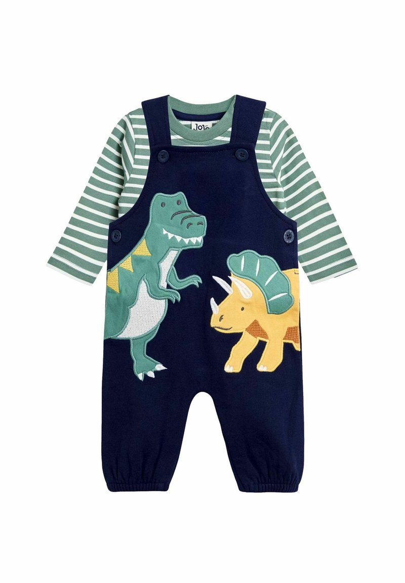Tengerészkék overál zöld csíkozott hosszú ujjú pólóval. Dinozorus hímzések: zöld T-rex és sárga triceratops. Puha anyag, kerek nyak.