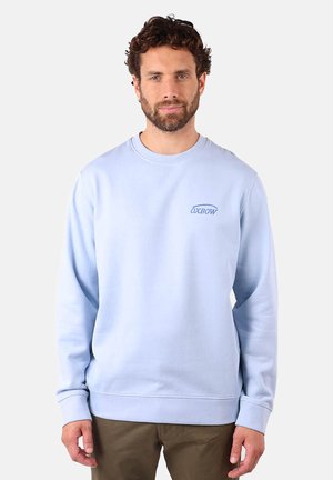 Sweatshirt bleu clair en mélange de coton, avec un col rond, des poignets côtelés et un logo brodé sur la poitrine. Texture lisse.