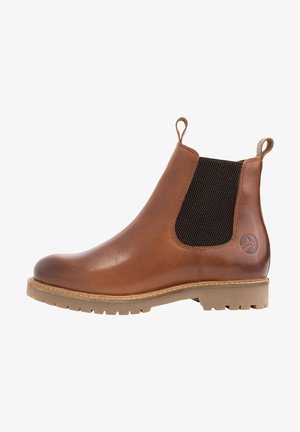 Bottine Chelsea en cuir marron avec panneau élastique noir sur le côté, languettes devant et derrière, et semelle en caoutchouc texturée.