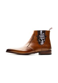 Braune Leder-Stiefelette mit spitzem Zehenbereich, die ein schwarz-weißes Totenkopfdesign an der Seite sowie eine dezente Zuglasche an der Ferse aufweist.