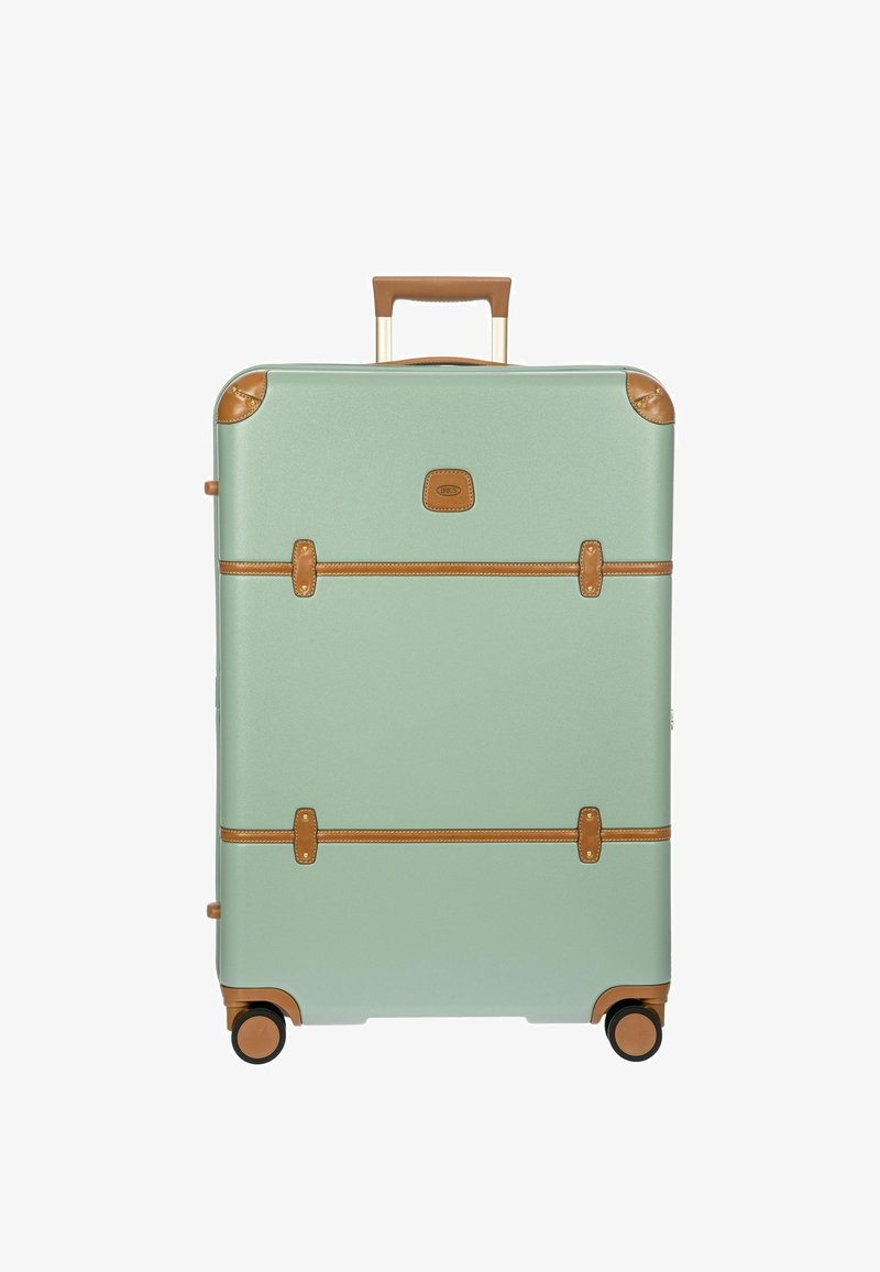 Maleta rígida de color verde menta con acentos de cuero marrón contrastante, dos correas, esquinas redondeadas y ruedas dobles para mayor movilidad.