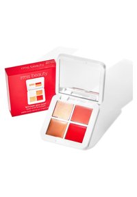 Quad de glow lip2cheek de RMS Beauty dans un compact blanc avec quatre teintes : pêche claire, beige pailleté, rose chaud et rouge foncé. Comprend un miroir.