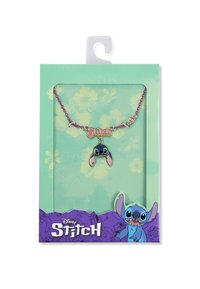 Collier rose et violet avec un charme en métal Stitch, présentant un visage de dessin animé et de longues oreilles. Présenté dans un emballage vert menthe et violet.