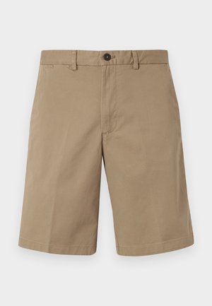 Tan shorts made of cotton, with a straight cut, two front pockets, and a button closure. Smooth texture with minimalist design.