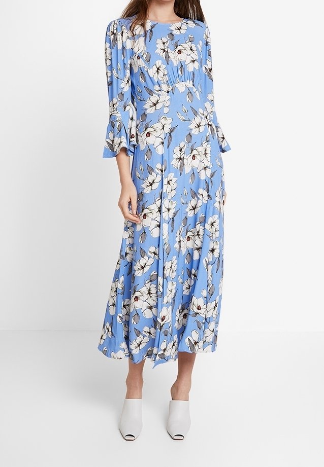 Floral print dress in light blue fabric with long sleeves and flared cuffs, featuring a variety of white flowers and a pleated bodice.