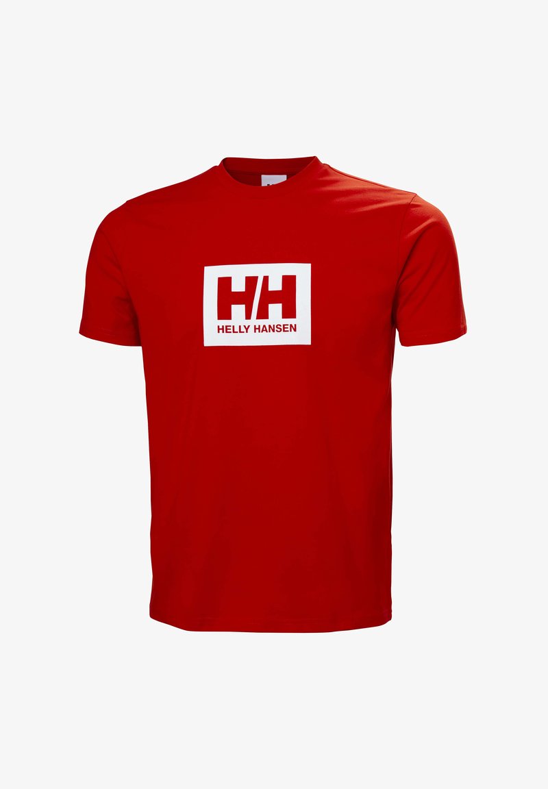 Camiseta de algodón de manga corta en rojo. Presenta un logo rectangular blanco con el texto "H/H" y "HELLY HANSEN" en fuentes negritas.