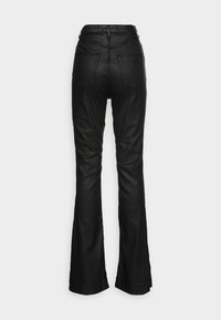 Black flared pants with a smooth, leather-like texture. Features four pockets and a waistband with visible stitching and logo detail.