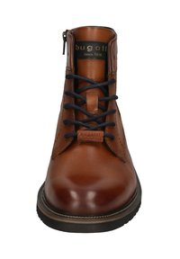 Braune Leder-Stiefel bis zu den Knöcheln mit strukturiertem Finish, runder Spitze, marineblauen Schnürsenkeln und seitlichem Reißverschluss. Markenlogo innen sichtbar. Gummisohle.