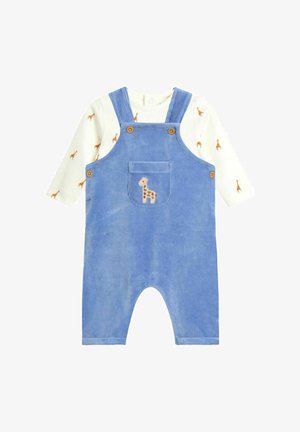 Blå baby-overalls i fløjl med frontlomme broderet med giraf, lagdelt over hvid langærmet skjorte med små girafprint.