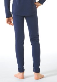Navy blue leggings with a smooth texture and a slim fit, featuring an elastic waistband and a hem that fits snugly around the ankles.