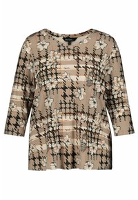 Plush beige topp med ett houndstooth- och blommönster, med trekvartslånga ärmar och rund halsringning. Mjuk tygtextur.