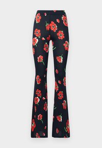 Svart flared leggings laget av stoff med et livlig blomstermønster med store røde blomster og grønne blader. Elastisk midjebånd for komfort.