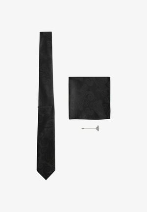 Black paisley patterned tie and matching pocket square with a silver butterfly-shaped lapel pin on a white background.