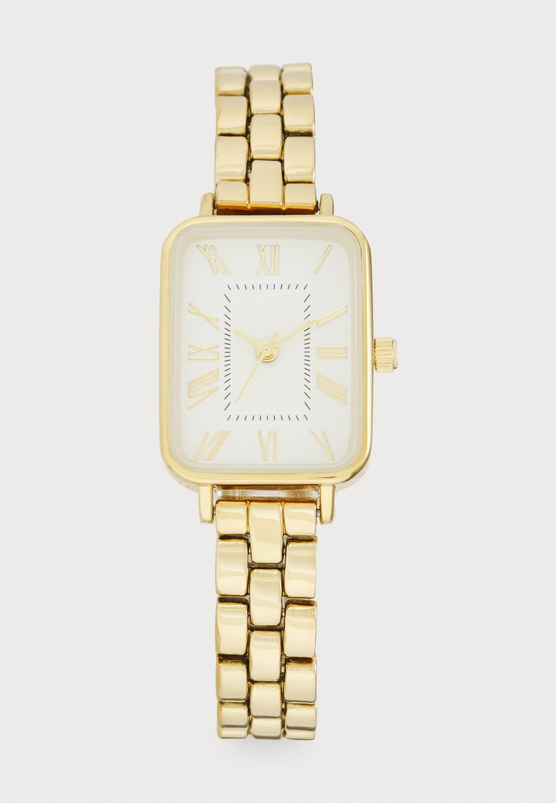 Gold wristwatch with a rectangular face, white dial, Roman numeral markers, and linked metal band. Simple design with a crown on the side.