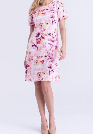 Floral print dress with short sleeves, made of lightweight fabric. Predominantly pink with yellow and purple accents. A-line silhouette.