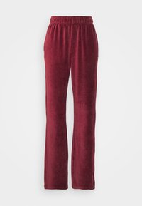 Bordeauxfärgade kordbyxor med avslappnad passform, med elastisk midja och vertikal ribbad textur, vilket ger ett mjukt och mysigt utseende.