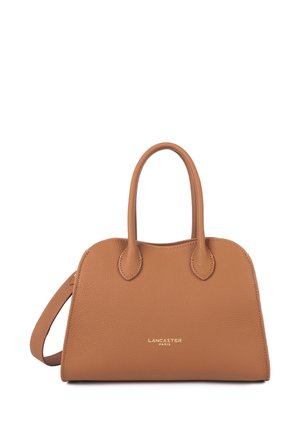 Tan leather Lancaster Paris handbag with two rounded handles and a detachable shoulder strap on a white background.