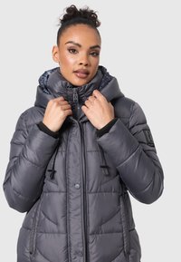 Gray puffer jacket with a high collar, zip closure, and two side pockets. Features toggle drawstrings and a smooth, shiny texture.