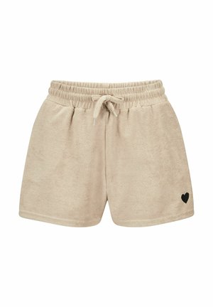 Beige Frotteshorts mit elastischem Bund, Kordelzug und kleinem schwarzen Herz, das unten am rechten Bein bestickt ist.