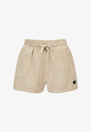 Beige Frotteshorts mit elastischem Bund, Kordelzug und kleinem schwarzen Herz, das unten am rechten Bein bestickt ist.