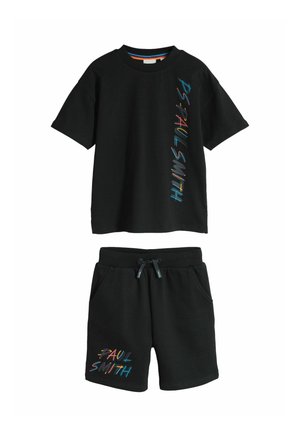 Black short-sleeve t-shirt and shorts set with colorful "PAUL SMITH" text printed vertically on the shirt and on the left leg of the shorts.