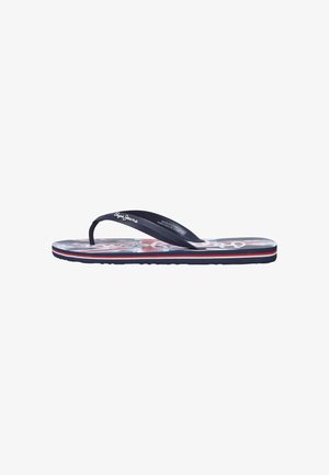 Tongs en caoutchouc avec une bande marine et une semelle texturée. Comprend un semelle intérieure colorée avec un motif rouge et blanc.