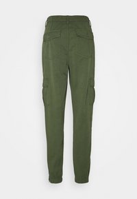 Green cargo pants with elastic waistband, tapered legs, and multiple pockets. Made of a soft material with a smooth texture.