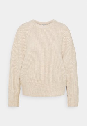 Pull en maille beige à la coupe décontractée, col rond et manches longues. Texture douce, design minimaliste et sans quincaillerie ni accents visibles.