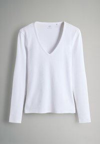 Weißes Langarm-V-Neck-Shirt aus geripptem Stoff; verfügt über ein figurbetontes Design und leicht zulaufende Ärmel mit geradem Saum.