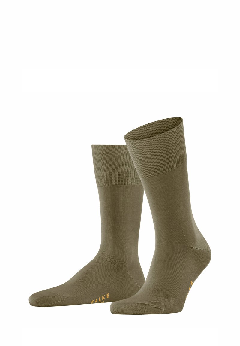 Chaussettes côtelées vert olive avec un talon et un orteil renforcés, arborant un logo jaune à la base, fabriquées en matériau élastique.