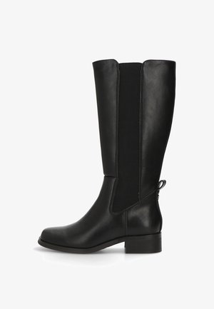 Botas de cuero negras hasta la rodilla con paneles laterales elásticos, punta redonda, tacón bajo y una tirador en la parte trasera para ponerlas y quitarlas con facilidad. Textura suave.