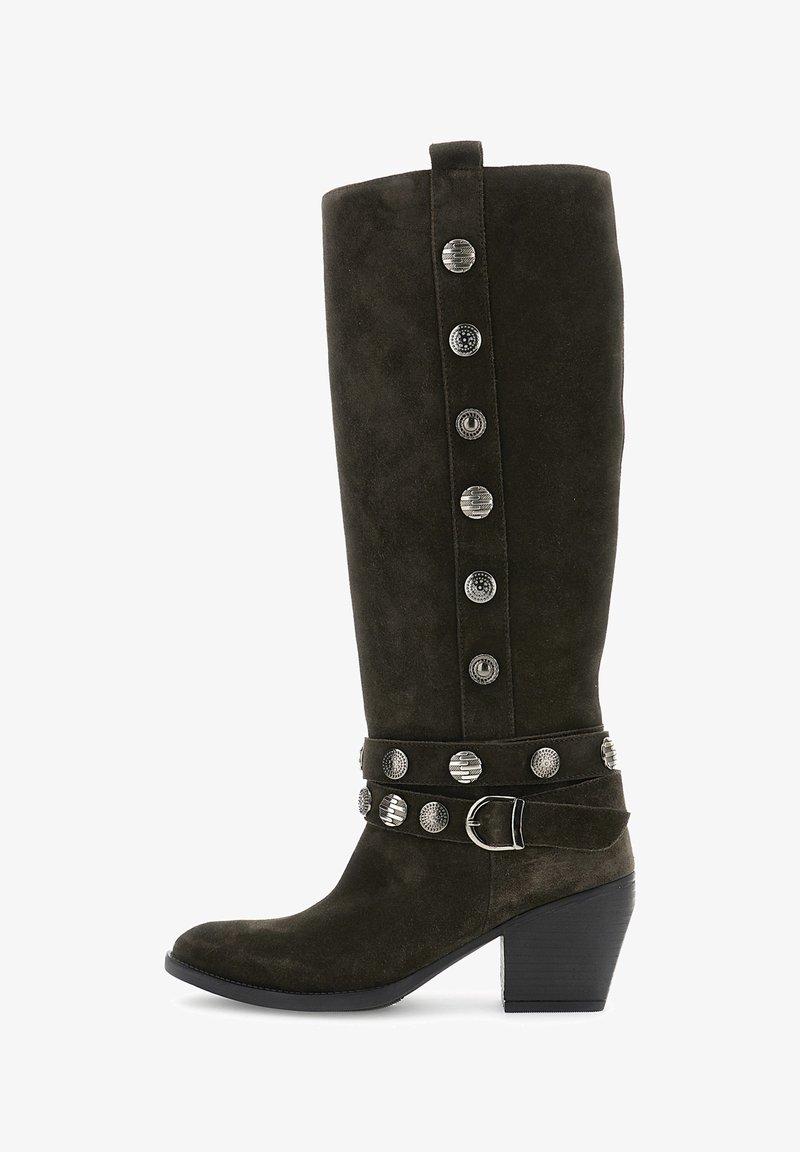 Tall dark brown suede boot with stacked heel, decorative silver studs, and buckle strap around the ankle.