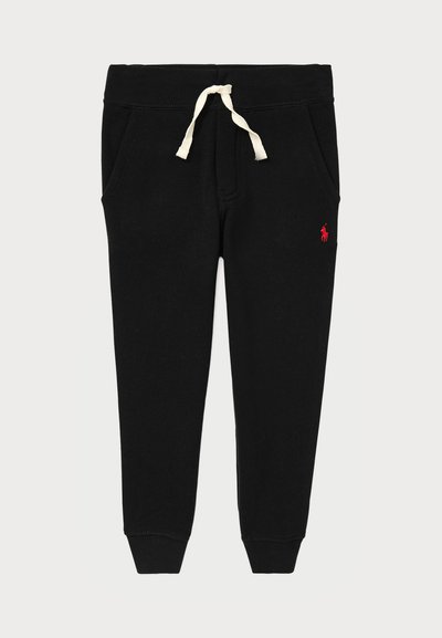 Jogging en coton noir avec une taille élastique et un cordon de serrage crème. Comprend des poches latérales et un petit logo rouge sur la cuisse gauche.