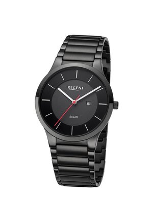 Montre-bracelet en métal noir avec cadran rond, aiguilles des heures et minutes blanches, aiguille des secondes rouge, fenêtre de date et mention solaire sur le cadran.