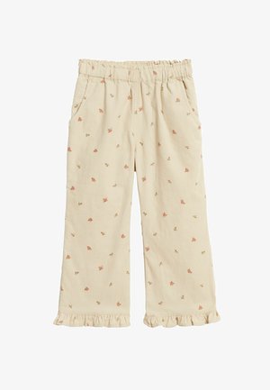 Jasnobeżowe bawełniane spodnie z falbaną u dołu i drobnym kwiatowym wzorem w odcieniach różu i zieleni. Mają elastyczną talię oraz boczne kieszenie.