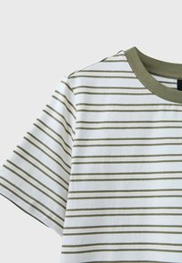 White short-sleeve shirt with thin olive green horizontal stripes and olive green ribbed collar, shown from shoulder to mid-chest.